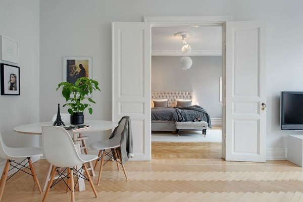 Clutter free living room looking into bedroom