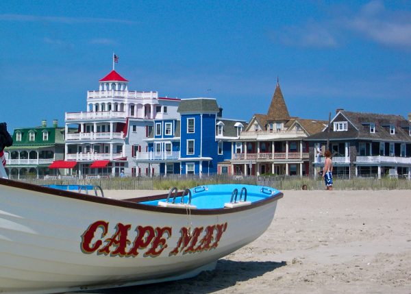 a small sailboat in the shores of cape may beach