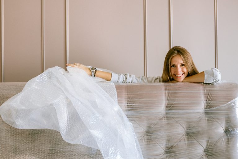 Woman smiling behin the headboard