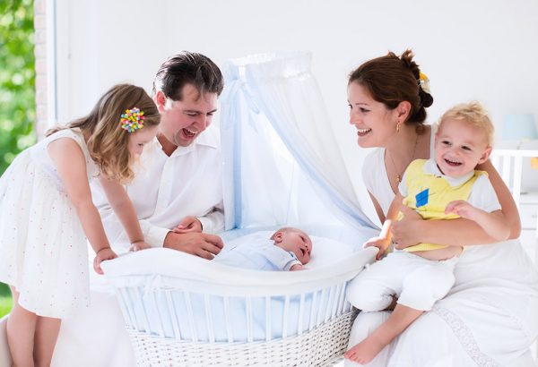 a happy family welcoming the new born baby