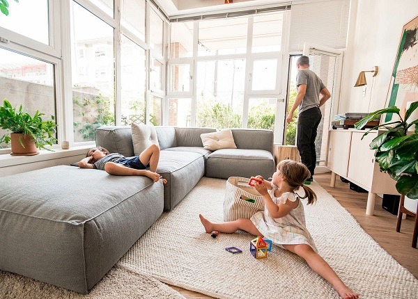 A girl playing with her toys on the floor