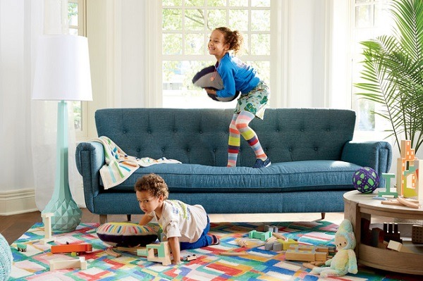Two kids playing in the livingroom